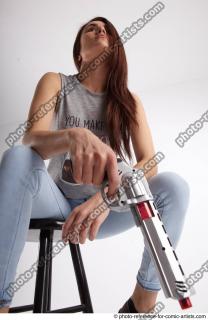 18 2020 MOLLY SITTING POSE WITH GUN 2